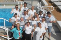 Graduates of a CPO course taught by Connie Sue Centrella (front, far left) gather on the deck of the Azamara Quest in the Greek islands (photo courtesy C.S. Centrella)