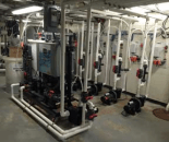 The NEX-GENpH® 80 is an on-site batch chlorine generator that uses salt (see feeder at left) instead of bulk chlorine to produce 80 lbs. of pH-neutral-equivalent chlorine per 24 hours. This unit was installed to feed five pools.