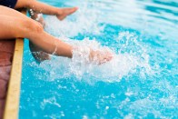 legs splashing water in pool