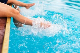 legs splashing water in pool