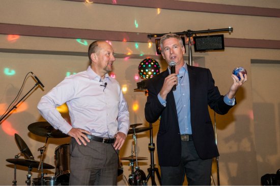 Wallace J. Nichols (right) presents Tom Lachocki, executive director of the National Swimming Pool Foundation, the Blue Mind award for raising awareness about the physical and cognitive benefits of swimming.