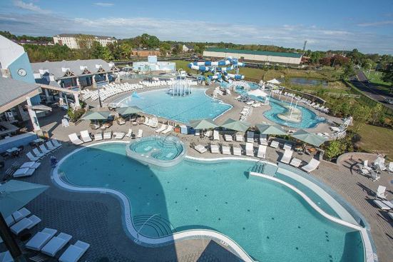 The aquatics center was laid out to seamlessly separate various age groups. The clock tower/chimney, seen to the left, is placed prominently to serve as a landmark meeting place and beacon.