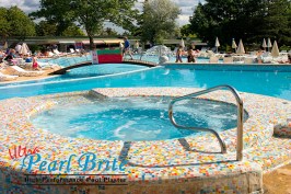 swimming pool at a resort and sky with clouds
