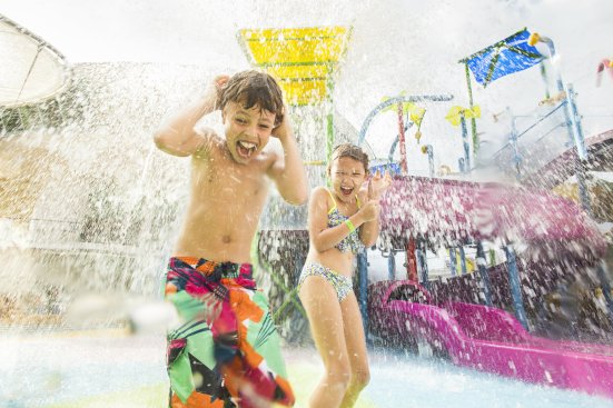 The giant dump bucket at the top of the wet play structure provides a downpour that can be enjoyed by all ages.