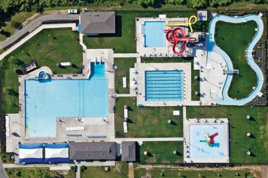 With a leisure pool,

competition pool, slide pool, lazy river and interactive pool,

Hilliard Family Aquatic Center is designed to serve a diverse

population. Work was completed in two phases, and the facility

replaces an old 50-meter pool and a wading pool. Featuring shallow

areas for toddlers, teen areas, competition and lap swimming, and

adult and senior areas, the design allows for the maximum amount of

water area in the confines of the site.